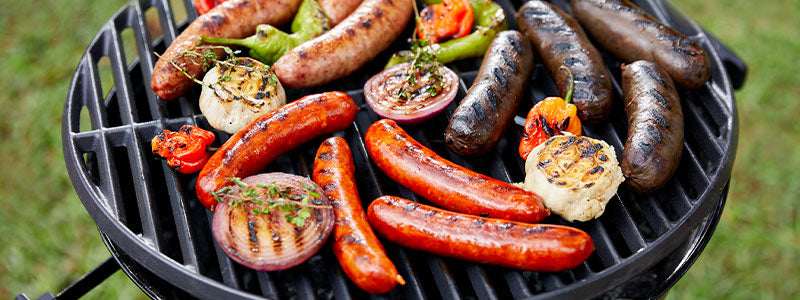 Photo of Grilling Sampler of Spanish Sausages on the grill with vegetables