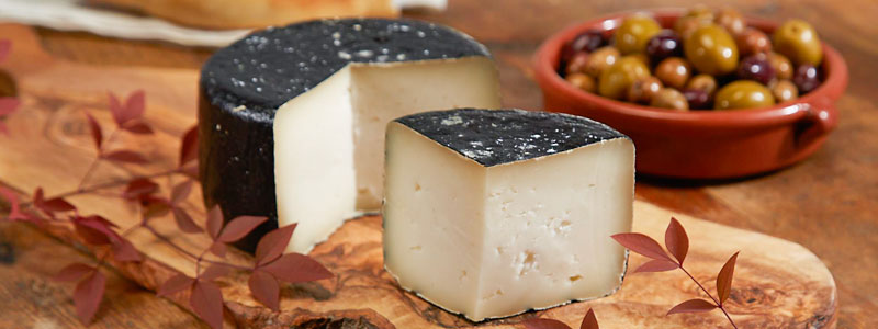 Photo of Queso Payoyo Cheese wedge on cutting board