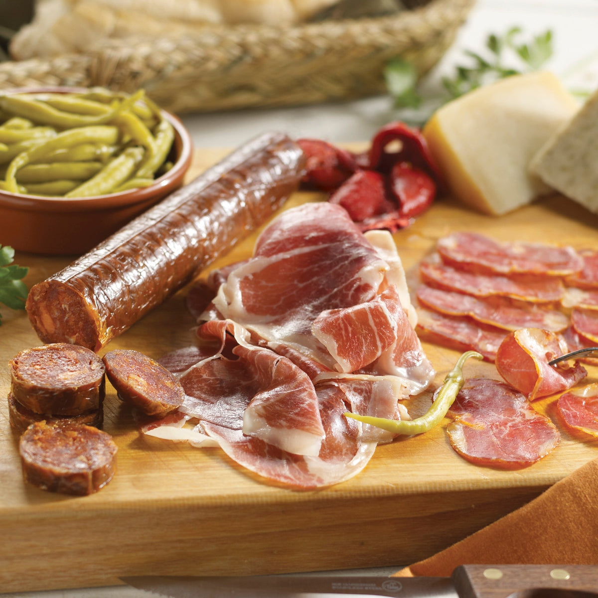 Photo of a charcuterie board with a variety of cured Iberico meats