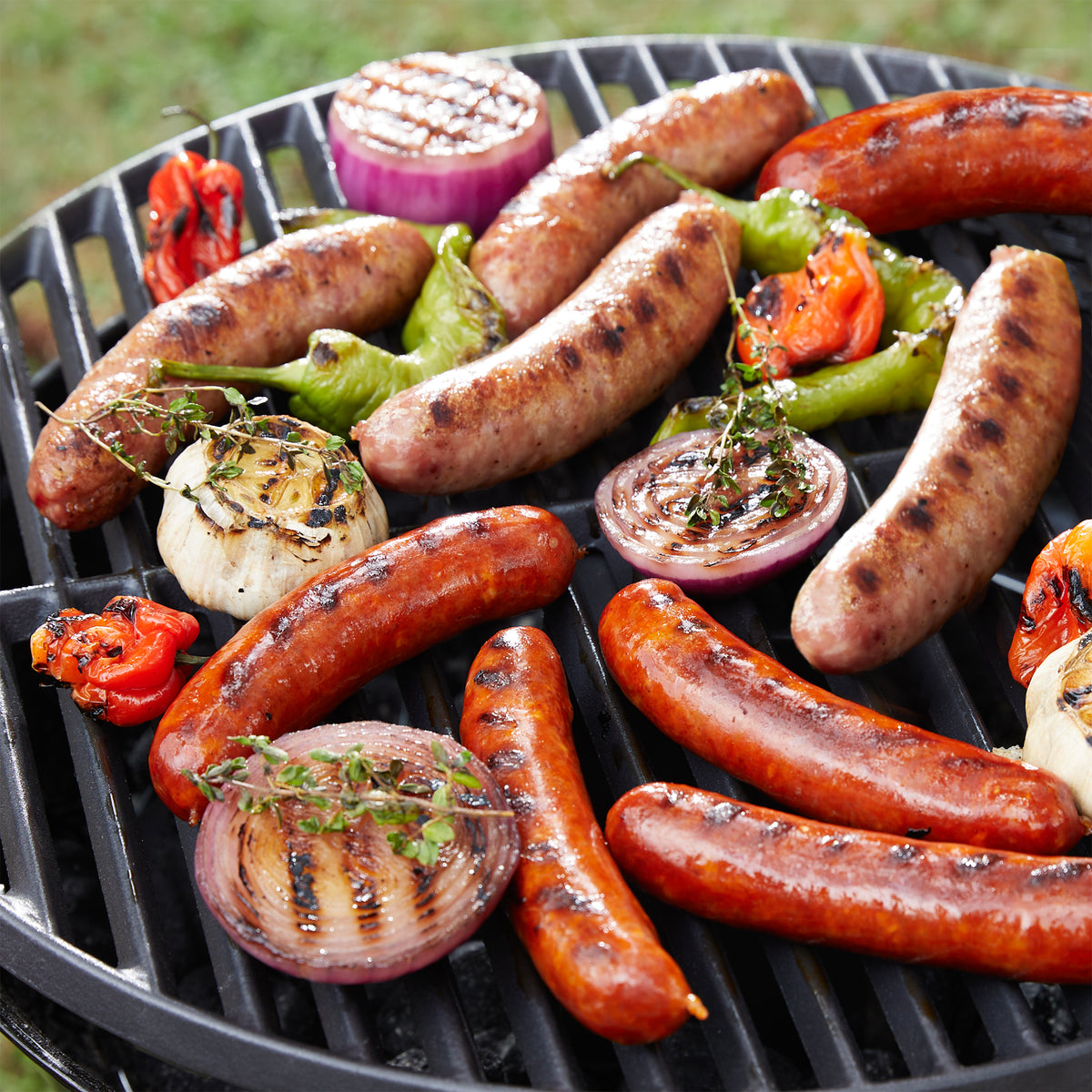 Photo of Grilling Sampler of Spanish Sausages on the grill with vegetables